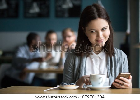 Curious girl looking at dessert ordered by flirting guys from table behind eavesdropping their interesting discussion in cafe, cunning millennial woman on diet preparing to eat tasty cheat meal cake