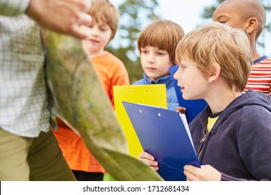 Curious Kids With Clipboard Play Treasure Hunt Or A Game Of Nature In Nature