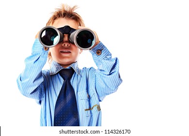 Curious little boy is looking through binoculars. Isolated over white background.