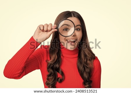 Curious mind. teen girl use magnifying glass for curiosity. school education for curious teen girl. magnifying and discovering. Unquenchable curiosity. Insatiable thirst for knowledge