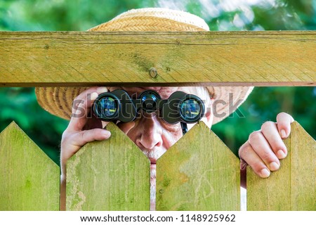 Similar – a curious neighbour looks over a garden fence