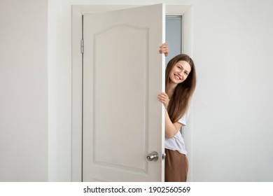 Curious Woman Looking Out The Door