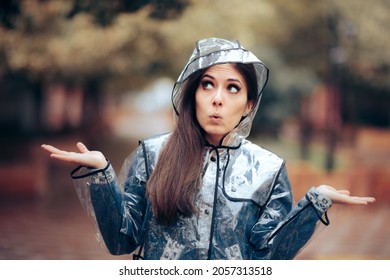 Curious Woman Shrugging Standing in the Rain. Funny curious young person walking in rainy weather
