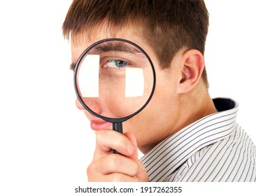 Curious Young Man With Magnifying Glass Isolated On The White Background