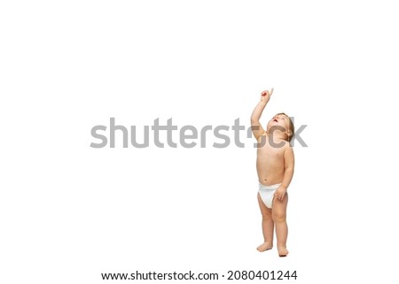 Curiousity, playful child. Portrait of little cute toddler boy, baby in diaper isolated over white studio background. Concept of childhood, motherhood, life, birth. Copy space for ad