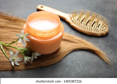 Curl Female Hair, Balm Or Hair Mask And Bamboo Comb On Black Background.