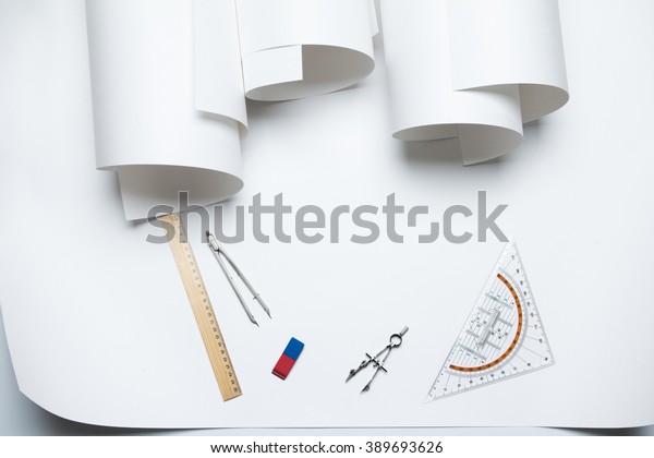 curled corner paper and rolls of whatman and\
stationery for drawing