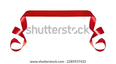 Curled red silk ribbon isolated on white background