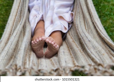 Curled Toes Of Little Girl In Hammock