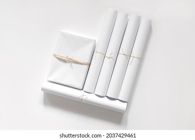 Curled White Paper Mockup And White Paper Gift Box. Rolled Paper. 