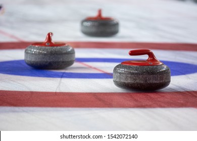 Curling game and stones on ice
