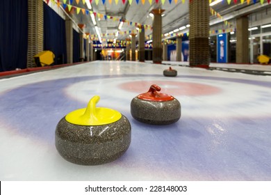 Curling Stone On Ice Of A Indoors Rink