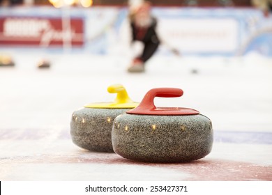 Curling stones on ice