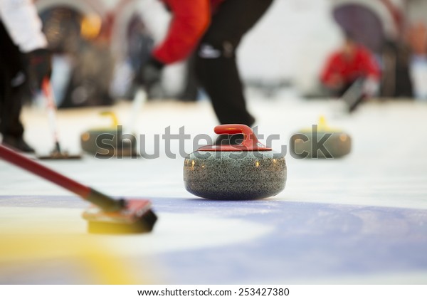 Curling stones on\
ice