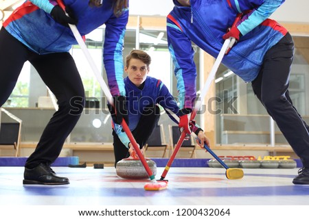 Curling. The curling team plays the tournament.