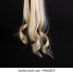 Curly Blond Hair Isolated On Black