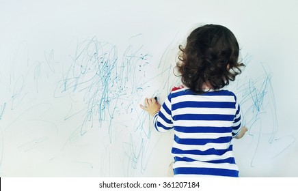 Curly cute little baby girl drawing and crayon color the wall  Works child