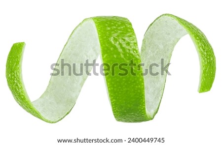 Curly lime peel twist isolated on a white background. Green lime zest.
