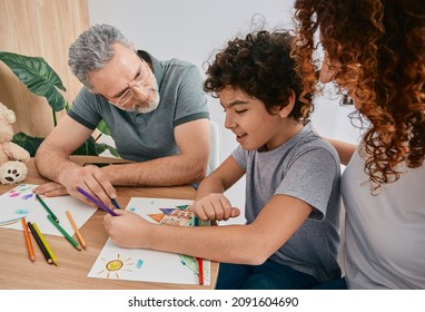 Curly Male Child With Mother During Art Therapy With Psychologist Counsel At Psychologist's Office. Children's Art Therapy