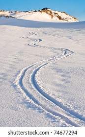 Curly Trace Of Skis On The Snow In The Mountains Of Antarctica