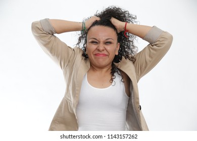 Curly-haired Girl, Pulling Her Hair In Despair. Teacher Or Stressed Mom