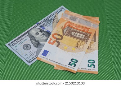 Currency Euro And Dollars. Money And Finance. Euro Banknotes On A Green Background