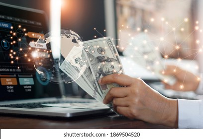 Currency exchange, financial and banking in global networking business concept. Businessman holding banknote, analysing stock market growth and making profit on currency converter exchange. - Shutterstock ID 1869504520