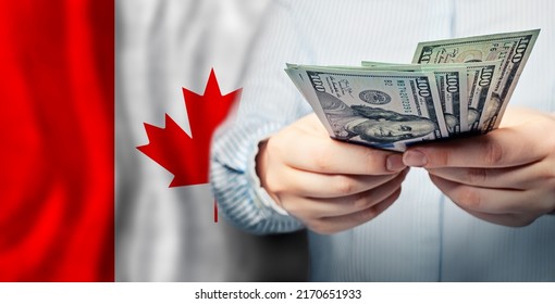 Currency Exchange, Finanse, Banking And Saving Money In Canada. US Dollars Cash On Canadian Flag Background