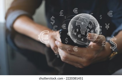 Currency exchange, money transfer, FinTech financial technology, Global business, online banking, interbank payment concept. Man using mobile phone and laptop computer with international currency - Shutterstock ID 2220381451