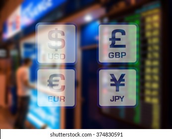 Currency Icons On Currency Exchange Booth At Airport Blurred Background