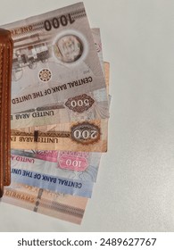 Currency notes, UAE Emirates currency aed Dirhams, Closeup of UAE dirhams currency notes, paper money aed dirhams.
United Arab Emirates Emirati aed dirhams bank notes isolated on white background. 