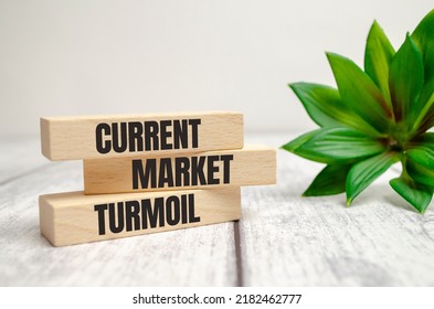 Current Market Turmoil On Wooden Blocks On A Beautiful White Table