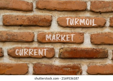 Current market turmoil symbol. Concept words Current market turmoil on red bricks on a beautiful brick wall background. Business, finacial current market turmoil concept. Copy space.