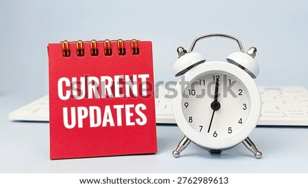 Current Updates Red Notepad Representing Time Management, Deadline Planning and Task Organization Concept for Business Productivity and Workflow Efficiency. 