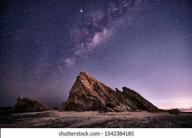 Currumbin rock with the Milky Way behind with lots of star on the Gold Coast, Queensland, Australia