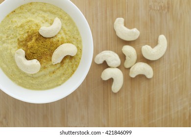 Curry Cashew Sauce On Wooden Background