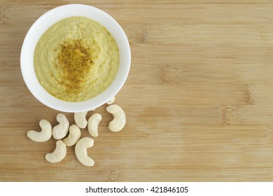 Curry Cashew Sauce On Wooden Background