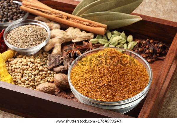 Curry Masala Powder with ingredients, Indian spice\
Powder. Selective focus