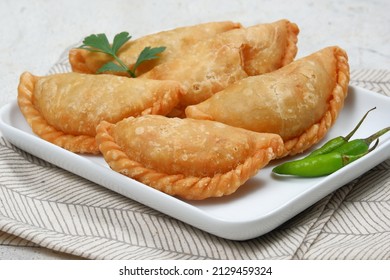 Curry Puff (kari Pap) Or Pastel Goreng Is Pastry Popular In Indonesia.
Fried Pastry With Filling Of Sautéed Vegetable , Chicken And Boiled Egg. Accompanied With  Sauce Or Raw Chilli Pepper