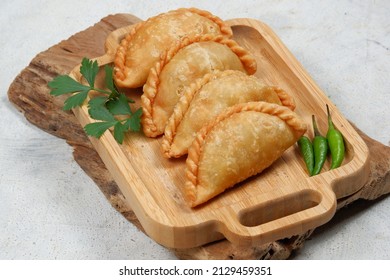 Curry Puff (kari Pap ) Or Pastel Goreng Is Pastry Popular In Indonesia.
Fried Pastry With Filling Of Sautéed Vegetable , Chicken And Boiled Egg. Accompanied With  Sauce Or Raw Chilli Pepper