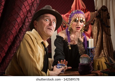 Cursed Mature Man With Gypsy Woman Reading Tea Leaves