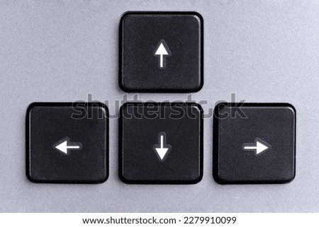 Cursor keys, left, right, top, down, direction keys or navigation arrow keys on gray computer keyboard