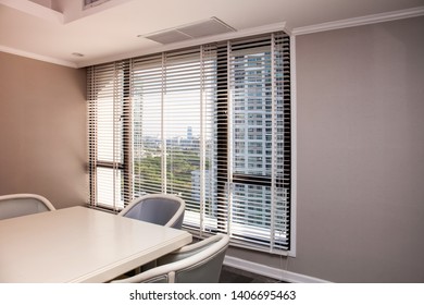 Curtain Blinds In A Small Meeting Room Overlooking The Outside