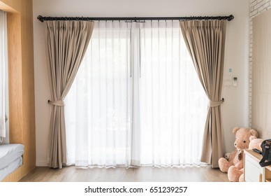 Curtain interior decoration in living room with sunlight - Shutterstock ID 651239257