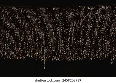 Curtain of magic Christmas lights in warm colour - Powered by Shutterstock