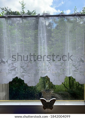 Similar – Image, Stock Photo Space. Wallpaper with forest motif, in the mirror is reflected a red and white chequered curtain and a neon tube. Lost taste, in need of renovation.