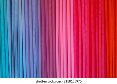 curtain in strips of blue red pink