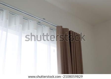 Curtains door or window, Curtain rail with white and brown curtain