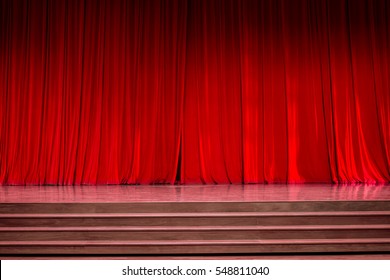 Curtains And The Stage Parquet With Stairs In Theater With Colorful Lighting.