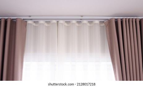 Curtains Used To Decorate The Interior With Brown Curtains And White Gauze, Sheer Cloth Hanging From Iron Rails.